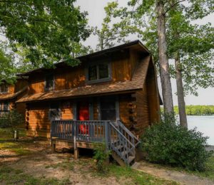 front view of log cabin on lake in fredericksburg virginia