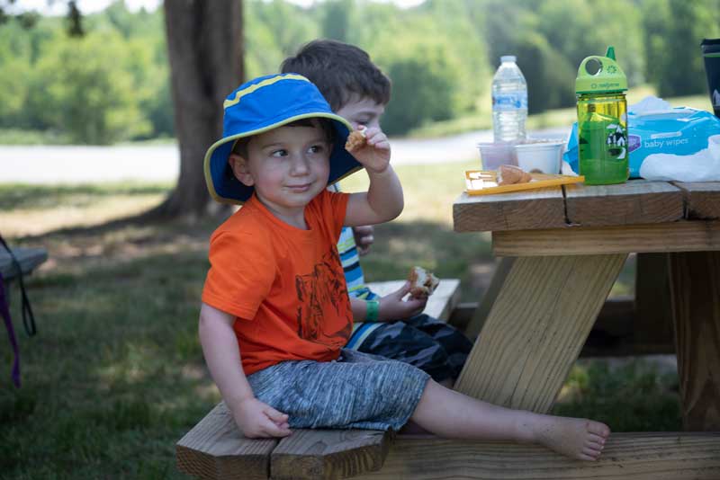 Little Kid at picnic table at Wilderness Presidential Resort