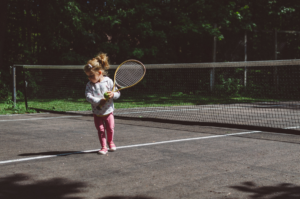 Child Playing Tennis at Wilderness Presidential Resort