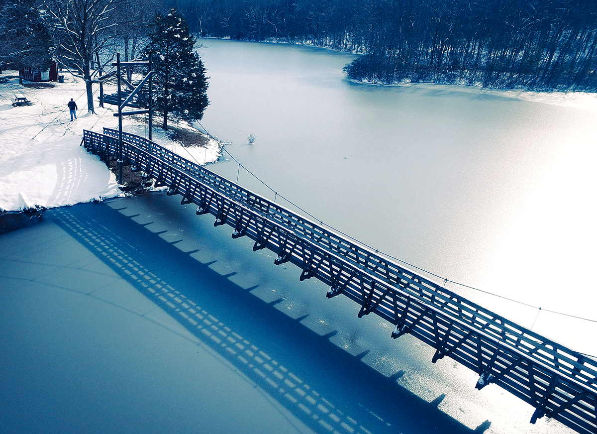 bridge over the lake in the snow